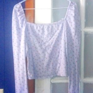 Blue shirt with flowers and a heart neck line